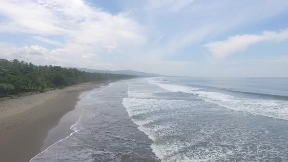 Bali aerial black beach and waves