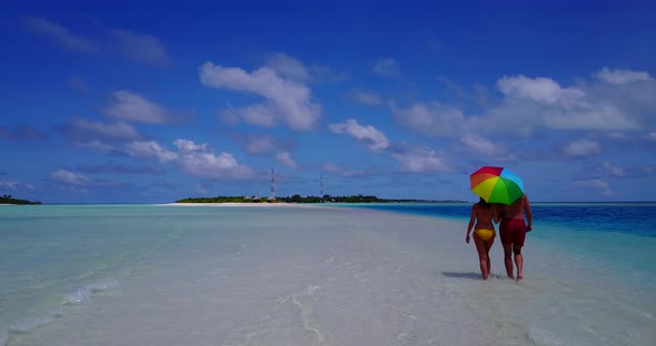 Young man and woman on honeymoon vacation live the dream on beach on summer white sandy background 4