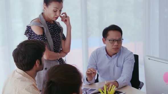 Unhappy Business People in Group Meeting After Project Failure