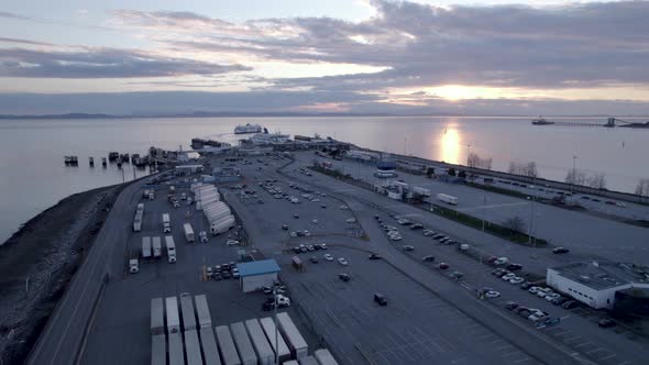 Many trucks at Tsawwassen Vancouver ferry terminal at twilight, British Columbia in Canada. Aerial d