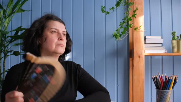 Overheated Woman Feeling Hot Waving Fan Annoyed with High Temperature