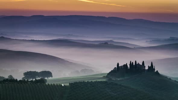 Sunrise over foggy valley in Tuscany 4k timelapse