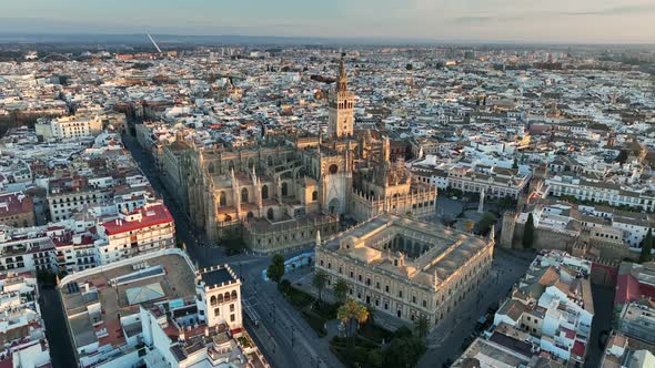 Flying Over Gothic Cathedral in Seville Old Town with Famous Giralda Bell Tower