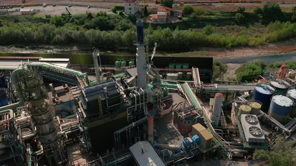 Aerial View. Oil Refinery and Oil Industry on the Background of Mountains.