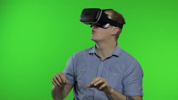 Man Using VR Headset Helmet To Play Game. Watching Virtual Reality 3d 360 Video. Chroma Key