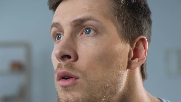 Happy Male Watching Sports Game on TV, Chanting and Supporting Team, Close-Up