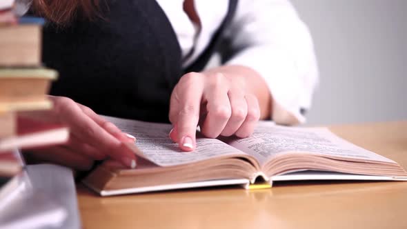 Girl Reading Book in Library