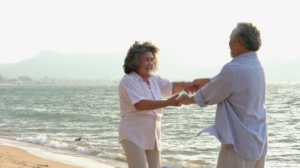 Couple senior leisure activities on the beach