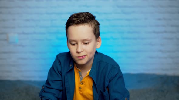 Boy puts on face medical mask against bacteria and viruses