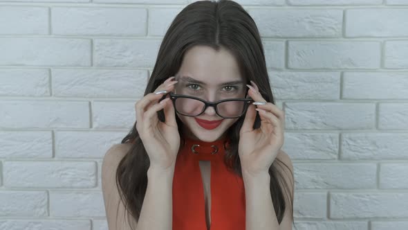 Beautiful girl in glasses for eyesight.