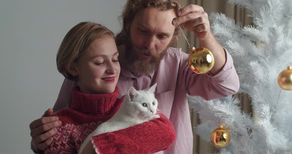 Close-up Portrait Caucasian Couple Young Family Wife and Bearded Husband Holding White Cat