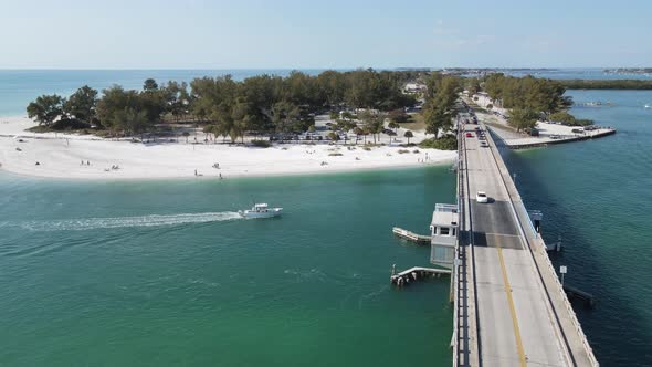 beautiful orbiting aerial of Longboat Pass looking north to Coquina Beach, from Longboat Pass Bridge