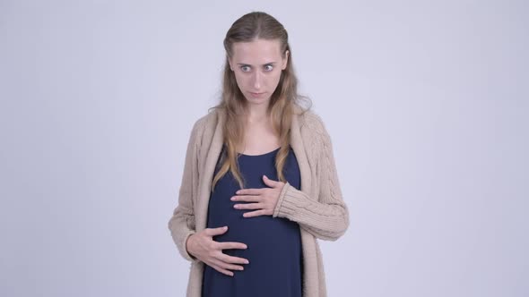 Young Stressed Pregnant Woman Looking Shocked