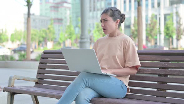 Indian Woman Coughing While Using Laptop in Office