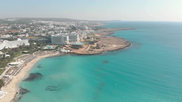 4k Aerial Drone Footage of the beautiful blue waters of Ayia Nappa's Nissi beach - Cyprus