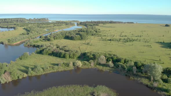 Fly over the river among the fields