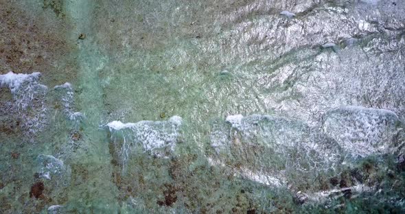 Luxury overhead abstract shot of a white sandy paradise beach and blue sea background in colourful