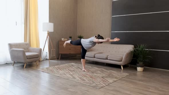 Young Indian Woman doing balance exercise and Stretching sports Yoga, Black Sportswear Leggings