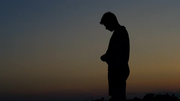 Praying Young Man Silhouette