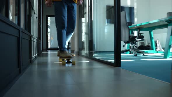 Modern Employee Riding Skateboard to Workplace