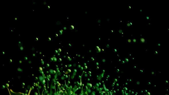 Green Paint Splashing With Droplets Into Air