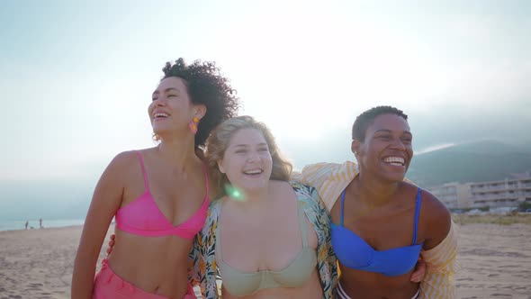 young women having fun on the beach