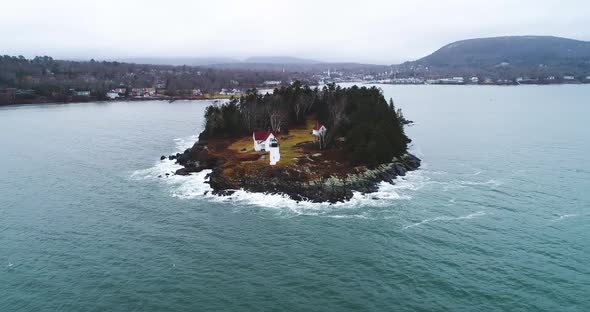 Zooming aerial shot of Curtis island lighthouse Camden Maine USA
