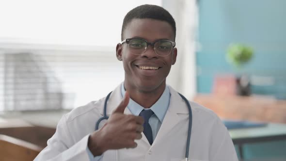 Young African Doctor Showing Thumbs Up Sign