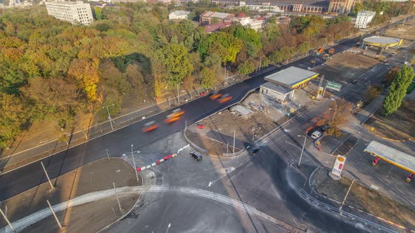 Construction Site of Avenue with Asphalt Paver Roller and Truck Aerial Timelapse