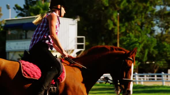 Woman riding horse in ranch 4k