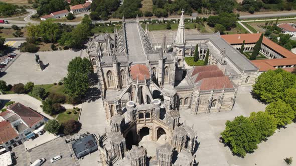 Architecture masterpiece building of Batalha Monastery, aerial orbit view