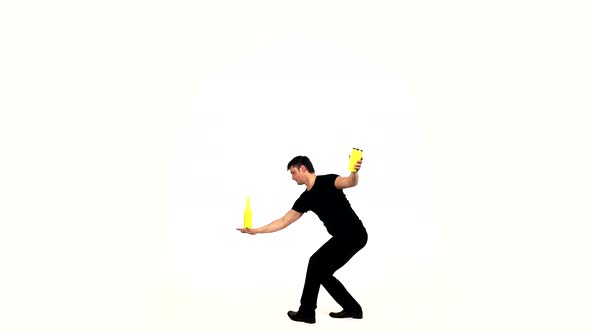 Bartender Making Cocktails with a Yellow Shaker