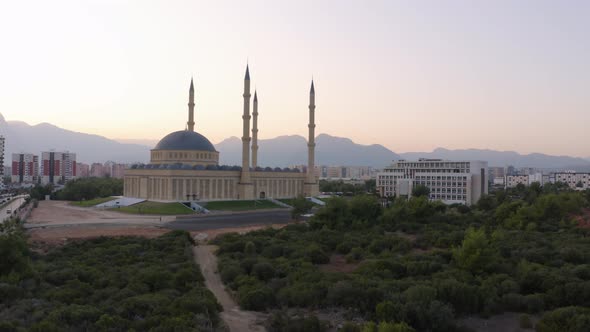 Top View of Blue Mosque Minaret and City Skyline with Mountains in the Background