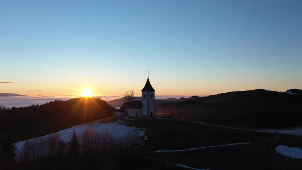 Church of St. Primoz and Felicijan at Sunrise. Julian Alps. Jamnik, Slovenia