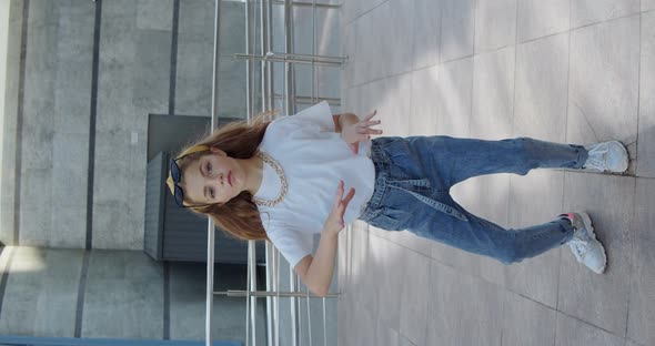 Cute Smiling Girl Dancing Hiphop in Front of Camera on Urban Area