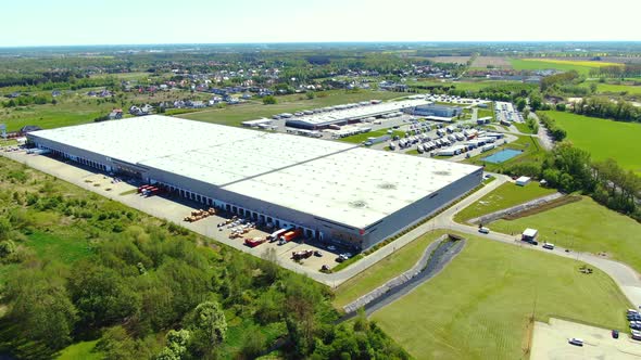 Aerial view of warehouse storages or industrial factory or logistics center from above. Top view of