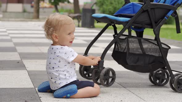 Mother and Little Child Walk in the Park in Summer Happy Kid Having Fun Playing on Footpath with