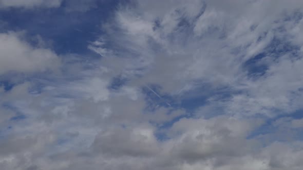 White Clouds Moving In Blue Sky At Daytime. - timelapse