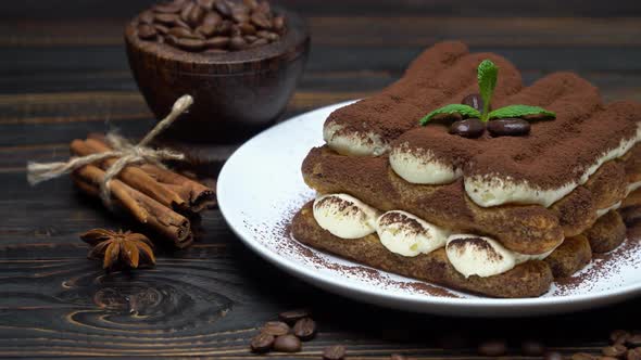 Classic Tiramisu Dessert on Ceramic Plate on Wooden Background