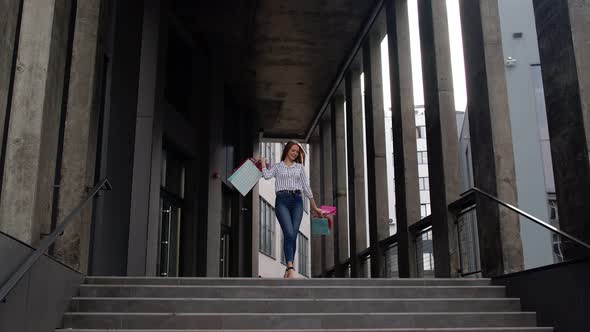 Girl with Shopping Bags, Spining, Dancing, Looking Satisfied with Purchase, Enjoying Price Discounts