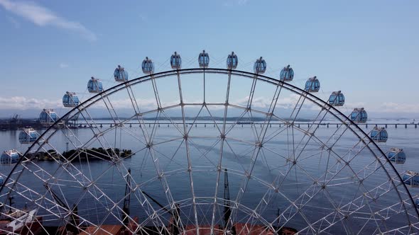 Famous ferris wheel at downtown Rio de Janeiro, Brazil. Landmark bridge background.