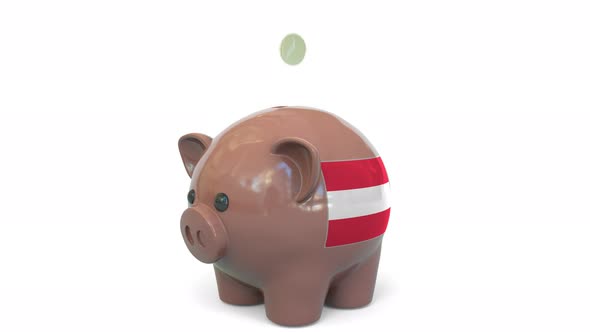 Putting Money Into Piggy Bank with Flag of Austria