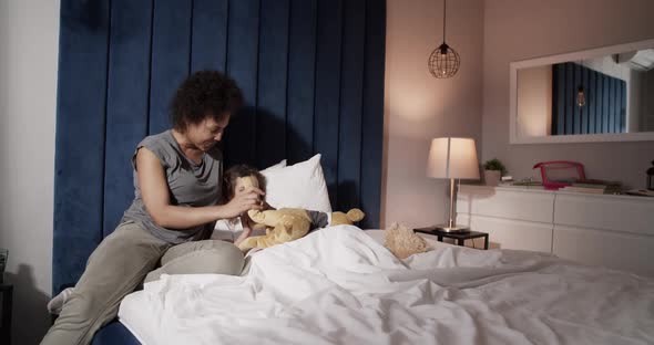 Mother Playing with Daughter in Morning