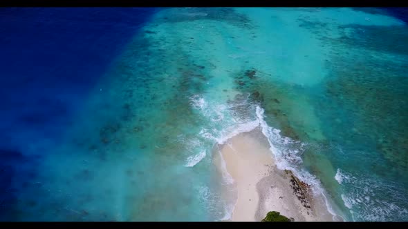 Aerial flying over panorama of exotic bay beach journey by aqua blue sea with white sandy background