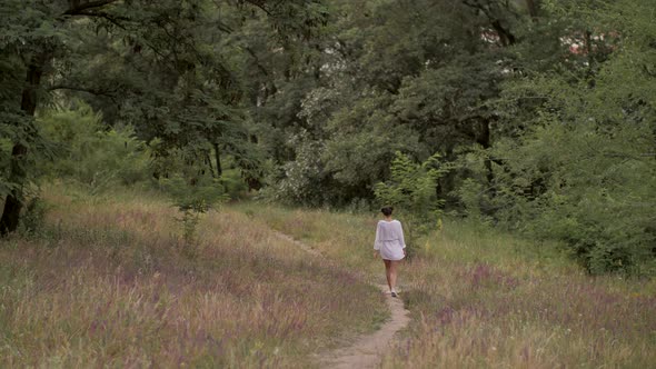 Beautiful Woman Walking Outdoors on Nature