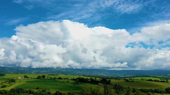 Countryside rural clouds Timelapse. Tropical scenery. Motion at blue sky.