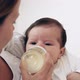 Mother bottle feeding baby girl - VideoHive Item for Sale