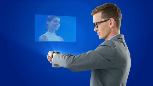 Digitally generated video of businessman having a video calling using smartwatch