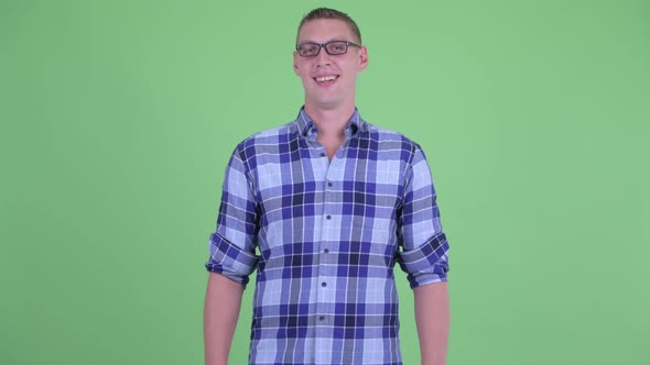 Happy Young Hipster Man with Eyeglasses Smiling