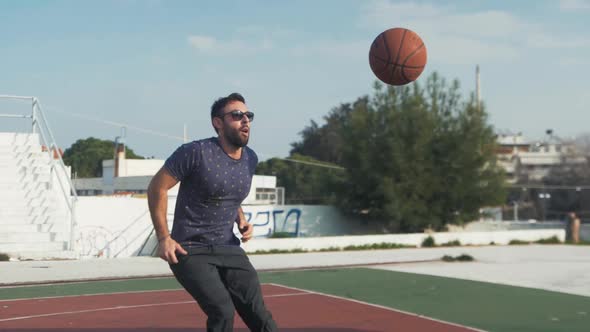 Male basketball spin 360 jump slow motion skillful shot